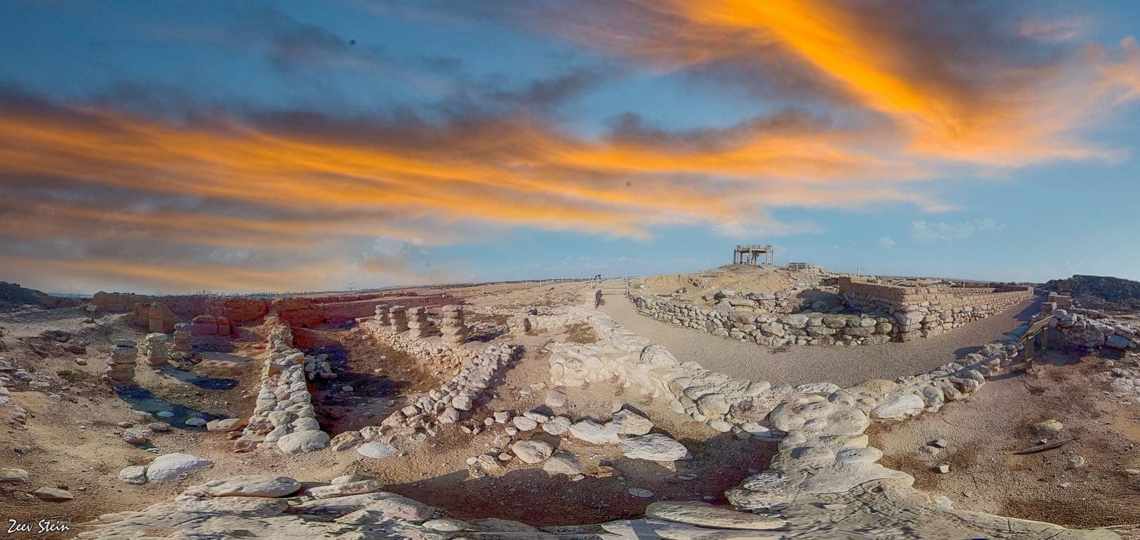 Panoramic view across Tel Beer Sheva archaeological site and surrounding landscape.